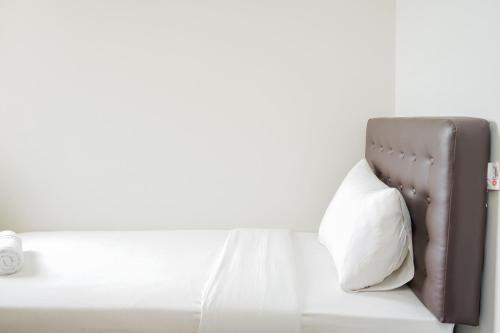 Fully Furnished with Comfortable Design 3BR Asatti Apartment By Travelio