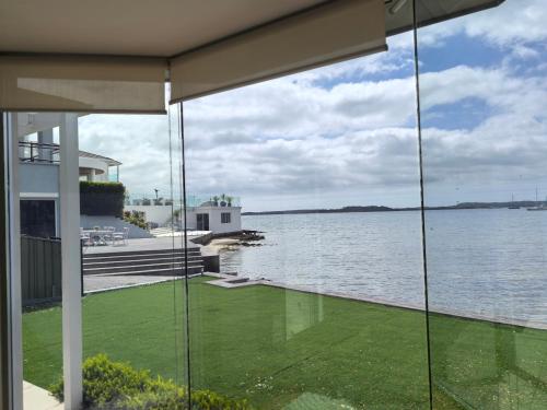 Beachfront Bliss 4BR Villa Direct Beach Access in Sutherland Shire Beachfront Bliss 4BR Villa Direct Beach Access in Sutherland Shire