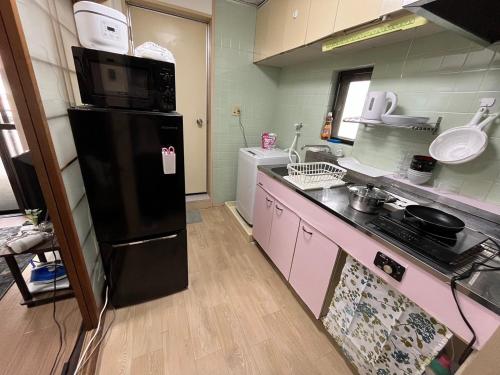 Kitchen, Guest House Happy Highness DAZAIFU in Dazaifu Kitchen, Guest House Happy Highness DAZAIFU in Dazaifu