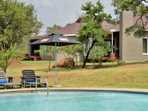 Garden, African Hills Safari Lodge & Spa in Magaliesburg Garden, African Hills Safari Lodge & Spa in Magaliesburg