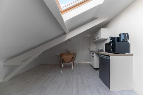 Cocina, Résidence Desroziers - Appartements design en centre ville (Residence Desroziers - Appartements design en centre ville) in Vichy Cocina, Résidence Desroziers - Appartements design en centre ville (Residence Desroziers - Appartements design en centre ville) in Vichy