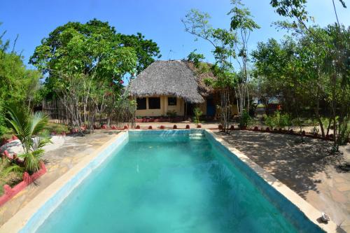 Pintu masuk, Gecko Nature Lodge Home of Swahili Divers the BEST dive center and Famous Gecko Restaurant in Pemba North Pintu masuk, Gecko Nature Lodge Home of Swahili Divers the BEST dive center and Famous Gecko Restaurant in Pemba North