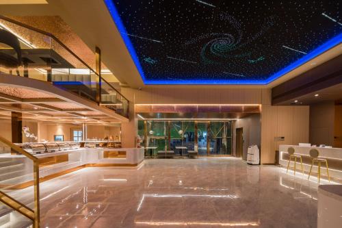 Lobby, Dequan Luxury Hotel Bird's Nest BranchCoffee, fruits, snacks, a gym and a laundry room are provided near Water Cube Lobby, Dequan Luxury Hotel Bird's Nest BranchCoffee, fruits, snacks, a gym and a laundry room are provided near Water Cube
