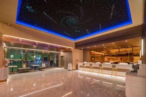 Lobby, Dequan Luxury Hotel Bird's Nest BranchCoffee, fruits, snacks, a gym and a laundry room are provided near Water Cube Lobby, Dequan Luxury Hotel Bird's Nest BranchCoffee, fruits, snacks, a gym and a laundry room are provided near Water Cube