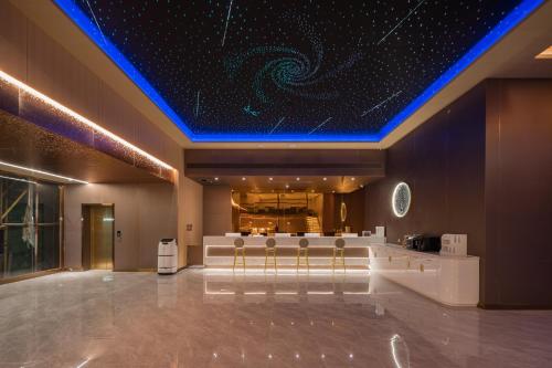 Lobby, Dequan Luxury Hotel Bird's Nest BranchCoffee, fruits, snacks, a gym and a laundry room are provided near Water Cube Lobby, Dequan Luxury Hotel Bird's Nest BranchCoffee, fruits, snacks, a gym and a laundry room are provided near Water Cube