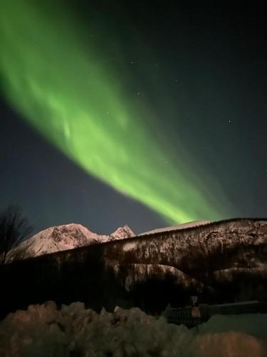 House near Reisa national park, Aurora and the Midnight sun in Storslett House near Reisa national park, Aurora and the Midnight sun in Storslett