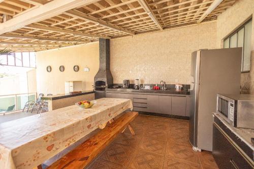 Balcony/terrace, Casa 4 Quartos c/ Varanda Gourmet e Piscina in Parque Real Balcony/terrace, Casa 4 Quartos c/ Varanda Gourmet e Piscina in Parque Real