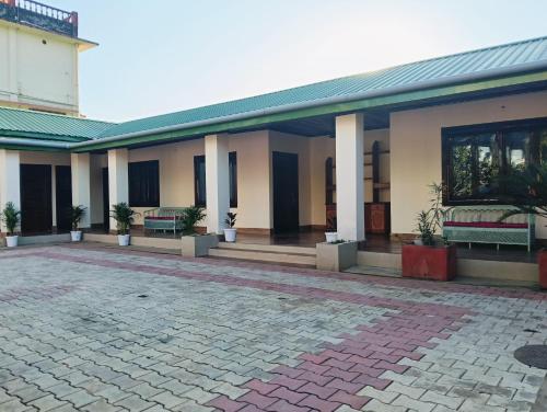 A szálláshely kívülről, 18 négyzetméteres, 1 hálószobás 1 fürdőszobával Atilagaon területén (Aurora Annex) near Jorhat repülőtér A szálláshely kívülről, 18 négyzetméteres, 1 hálószobás 1 fürdőszobával Atilagaon területén (Aurora Annex) near Jorhat repülőtér