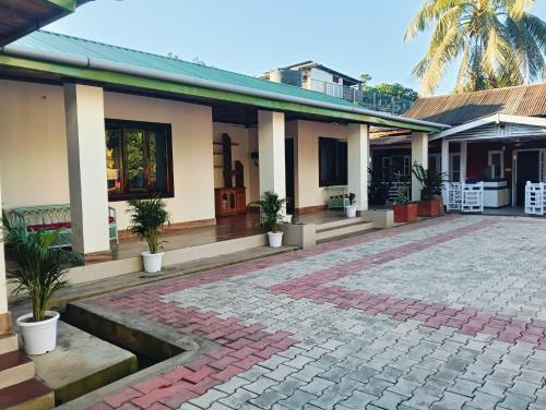 A szálláshely kívülről, 18 négyzetméteres, 1 hálószobás 1 fürdőszobával Atilagaon területén (Aurora Annex) near Jorhat repülőtér A szálláshely kívülről, 18 négyzetméteres, 1 hálószobás 1 fürdőszobával Atilagaon területén (Aurora Annex) near Jorhat repülőtér