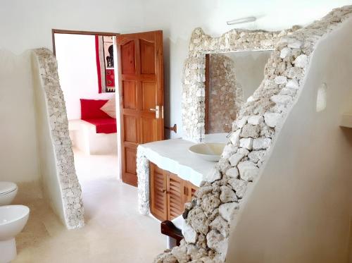 Baño, Spacious accessible house in Watamu, shared pool in Watamu Baño, Spacious accessible house in Watamu, shared pool in Watamu