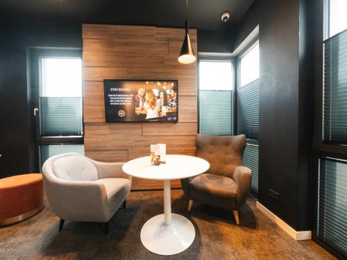 sala de TV, JustStay Grevenbroich Hotel & Apartments in Grevenbroich sala de TV, JustStay Grevenbroich Hotel & Apartments in Grevenbroich