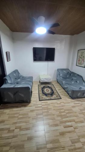 Shared lounge/TV area, J’s Guest House in Imus Shared lounge/TV area, J’s Guest House in Imus