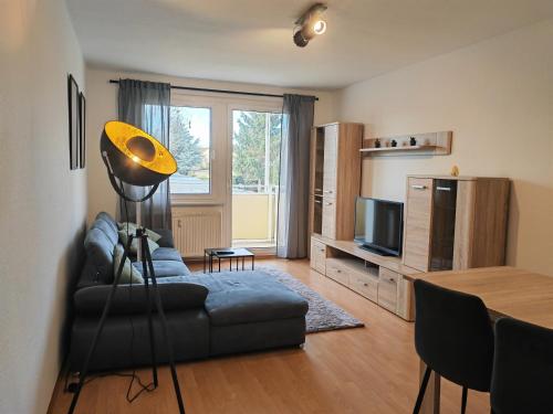 Közös társalgó / TV, Ferienwohnung im Musikerviertel in Bitterfeld-Wolfen Közös társalgó / TV, Ferienwohnung im Musikerviertel in Bitterfeld-Wolfen