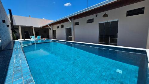 游泳池, Piscina Aquecida, 4 Suítes e Área Gourmet, Casa Nova (Piscina Aquecida, 4 Suites e Area Gourmet, Casa Nova) in 博皮兰加 游泳池, Piscina Aquecida, 4 Suítes e Área Gourmet, Casa Nova (Piscina Aquecida, 4 Suites e Area Gourmet, Casa Nova) in 博皮兰加