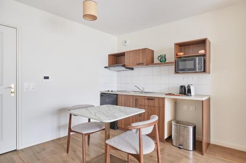 Kitchen, Appart Hotel Paris Levallois Maurice Ravel in Levallois-Perret Kitchen, Appart Hotel Paris Levallois Maurice Ravel in Levallois-Perret