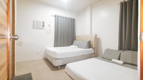 Cozy Cove Inn by RedDoorz in Bacolod (Negros Occidental) Cozy Cove Inn by RedDoorz in Bacolod (Negros Occidental)