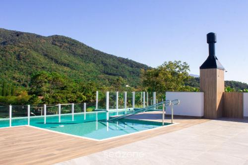 Úszómedence, Apto moderno com piscina e churrasqueira CRR201 in Pedrita Úszómedence, Apto moderno com piscina e churrasqueira CRR201 in Pedrita