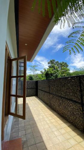 Balcony/terrace, Playa La Barka Resort by Raminten in Sendangagung Balcony/terrace, Playa La Barka Resort by Raminten in Sendangagung