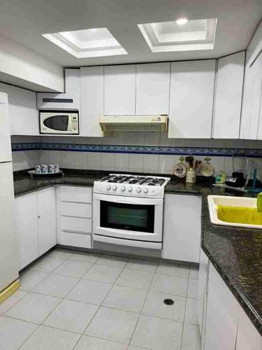 Kitchen, Playa Dorada calidez y frescura marina in Boca de Aroa Kitchen, Playa Dorada calidez y frescura marina in Boca de Aroa