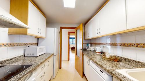 Kitchen, Apartamento Yuka by Family Homes in Las Rotas Beach Kitchen, Apartamento Yuka by Family Homes in Las Rotas Beach