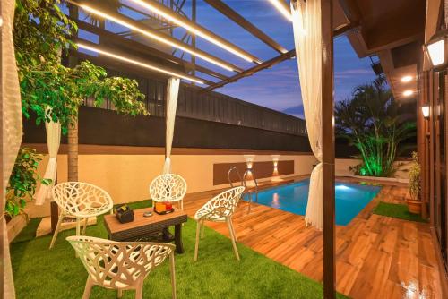 Swimming pool, Canary Villa by Tropicana Stays in Kune Village Swimming pool, Canary Villa by Tropicana Stays in Kune Village