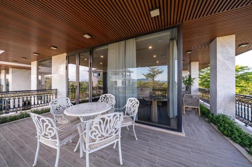 Balcony/terrace, Cami Riverside Resort Da Nang in Hoa Vang Balcony/terrace, Cami Riverside Resort Da Nang in Hoa Vang
