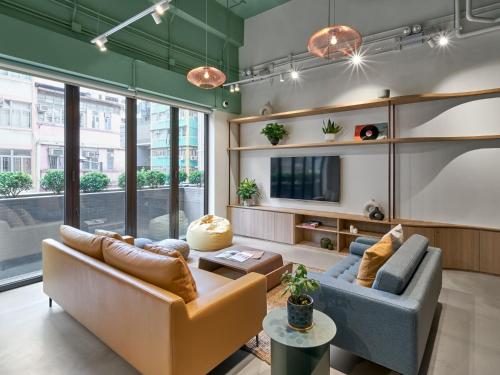 Shared lounge/TV area, Weave Studios – Kai Tak near Wong Tai Sin MTR Station Shared lounge/TV area, Weave Studios – Kai Tak near Wong Tai Sin MTR Station
