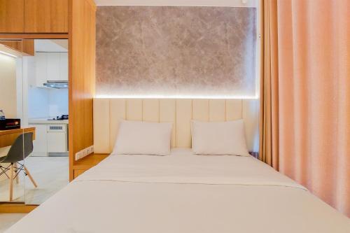 Homey and Best Choice Studio Apartment Sky House BSD By Travelio