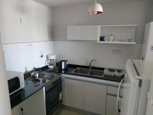 Kitchen, Departamento Centrico in Puerto Madryn Kitchen, Departamento Centrico in Puerto Madryn