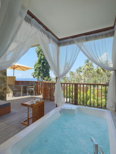 Balcony/terrace, Candi Beach Resort and Spa in Candidasa Balcony/terrace, Candi Beach Resort and Spa in Candidasa