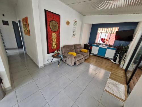 Phòng chờ chung/khu vực TV, Chambres d'hôtes dans Villa à Chateauboeuf (Chambres d'hotes dans Villa a Chateauboeuf) in Fort-de-France Phòng chờ chung/khu vực TV, Chambres d'hôtes dans Villa à Chateauboeuf (Chambres d'hotes dans Villa a Chateauboeuf) in Fort-de-France
