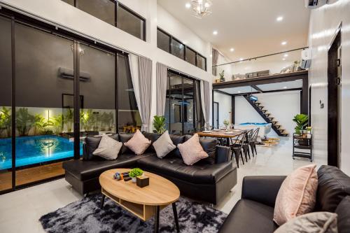 Shared lounge/TV area, Black Rocher Poolvilla Huahin near Hutsadin Elephant Foundation Shared lounge/TV area, Black Rocher Poolvilla Huahin near Hutsadin Elephant Foundation