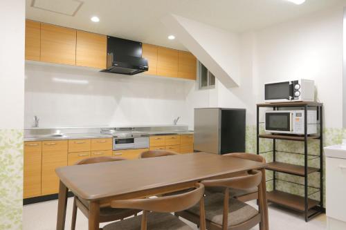 Shared lounge/TV area, 遊悠館 in Chitose Shared lounge/TV area, 遊悠館 in Chitose