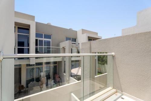 Balcony/terrace, Tranquil 3BR Villa with Malibu Beach Access in Damac Hills 2 Balcony/terrace, Tranquil 3BR Villa with Malibu Beach Access in Damac Hills 2