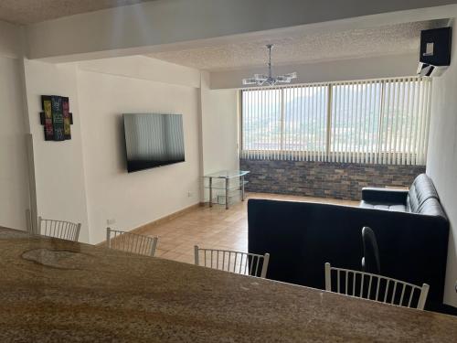 공용 라운지/TV 시청 구역, Apartamento en Lecheria in 푸에르토 라 크루스 공용 라운지/TV 시청 구역, Apartamento en Lecheria in 푸에르토 라 크루스