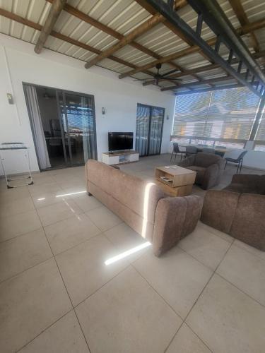 Aufenthaltsraum/TV-Zimmer, Cosy Apartment - 15minutes walk to the beach in Pointe aux Cannoniers Aufenthaltsraum/TV-Zimmer, Cosy Apartment - 15minutes walk to the beach in Pointe aux Cannoniers