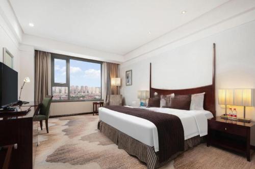 Grand New Century Hotel Binhai Tianjin in منطقة باي هاس للتنمية الاقتصادية Grand New Century Hotel Binhai Tianjin in منطقة باي هاس للتنمية الاقتصادية