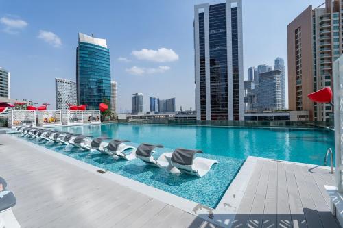 Swimming pool, VOGUE MAG318 Business Bay - Downtown Dubai - Pool View with balcony and walkable to Burj Khalifa and in Madinat Zayid Swimming pool, VOGUE MAG318 Business Bay - Downtown Dubai - Pool View with balcony and walkable to Burj Khalifa and in Madinat Zayid