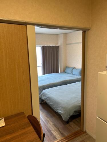Two devided rooms with three large beds close to Nipponbashi