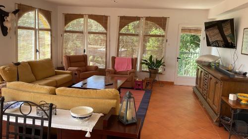 Közös társalgó / TV, Finca Jaralta de Carmen in La Puebla De Los Infantes Közös társalgó / TV, Finca Jaralta de Carmen in La Puebla De Los Infantes