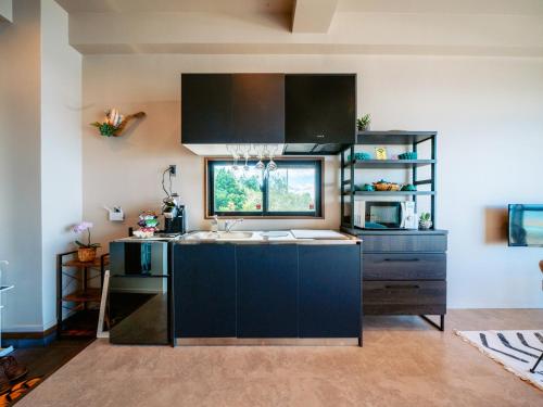 Kitchen, 海と星空の小さな宿 wassa wassa in Ogimi Kitchen, 海と星空の小さな宿 wassa wassa in Ogimi