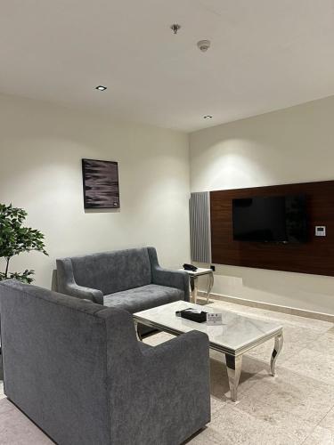 Közös társalgó / TV, كيان للاجنحة الفندقية ابها in Sirr Al Ghaliz Közös társalgó / TV, كيان للاجنحة الفندقية ابها in Sirr Al Ghaliz