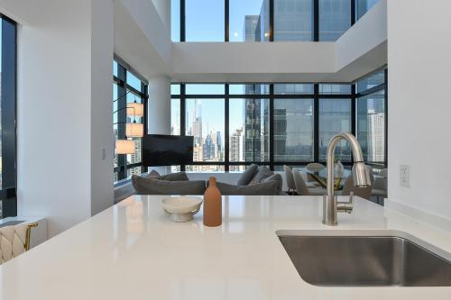 Kitchen, Opulent 2BR Duplex - Iconic Midtown Views in Upper East Side Kitchen, Opulent 2BR Duplex - Iconic Midtown Views in Upper East Side