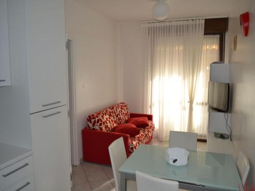 Közös társalgó / TV, Renovated flat with pool and terrace near the beach in Rosolina Mare Közös társalgó / TV, Renovated flat with pool and terrace near the beach in Rosolina Mare