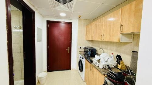 Kitchen, O07 Luxury Furnished Studio Apartment near bus stop Garden view Persia Cluster in Dubai International City Kitchen, O07 Luxury Furnished Studio Apartment near bus stop Garden view Persia Cluster in Dubai International City