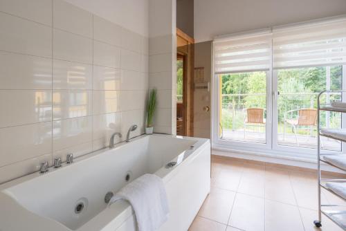 Spa, Ferienpark Rubezahl am Muggelsee, Haus 13 Erle mit eigener Sauna, idealer Ort fur Natur- und Erholun in Kopenick Spa, Ferienpark Rubezahl am Muggelsee, Haus 13 Erle mit eigener Sauna, idealer Ort fur Natur- und Erholun in Kopenick