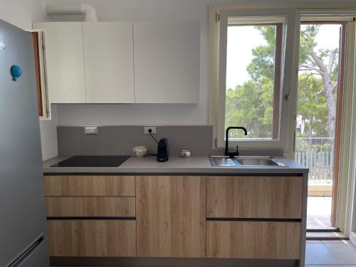 keuken, Pinetamare Azur - Panoramic Rooftop villa apartment Porto Selvaggio in Santa Caterina keuken, Pinetamare Azur - Panoramic Rooftop villa apartment Porto Selvaggio in Santa Caterina