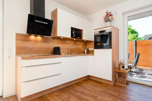 DeichRelax, Neubau im Erdgeschoss mit Garten und Infrarotkabine! in Norden DeichRelax, Neubau im Erdgeschoss mit Garten und Infrarotkabine! in Norden