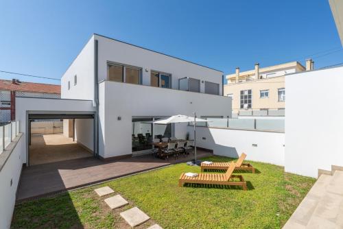 Exterior view, Stylish Home w/ Garage & Terrace by HostWise in Senhora Da Hora Exterior view, Stylish Home w/ Garage & Terrace by HostWise in Senhora Da Hora