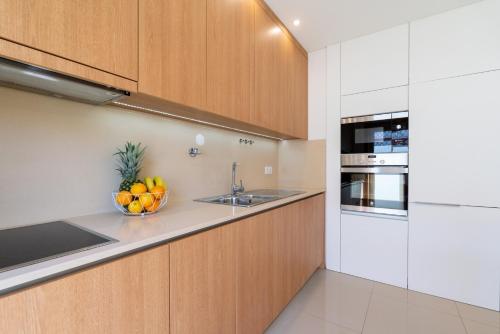 Kitchen, Stylish Home w/ Garage & Terrace by HostWise in Senhora Da Hora Kitchen, Stylish Home w/ Garage & Terrace by HostWise in Senhora Da Hora